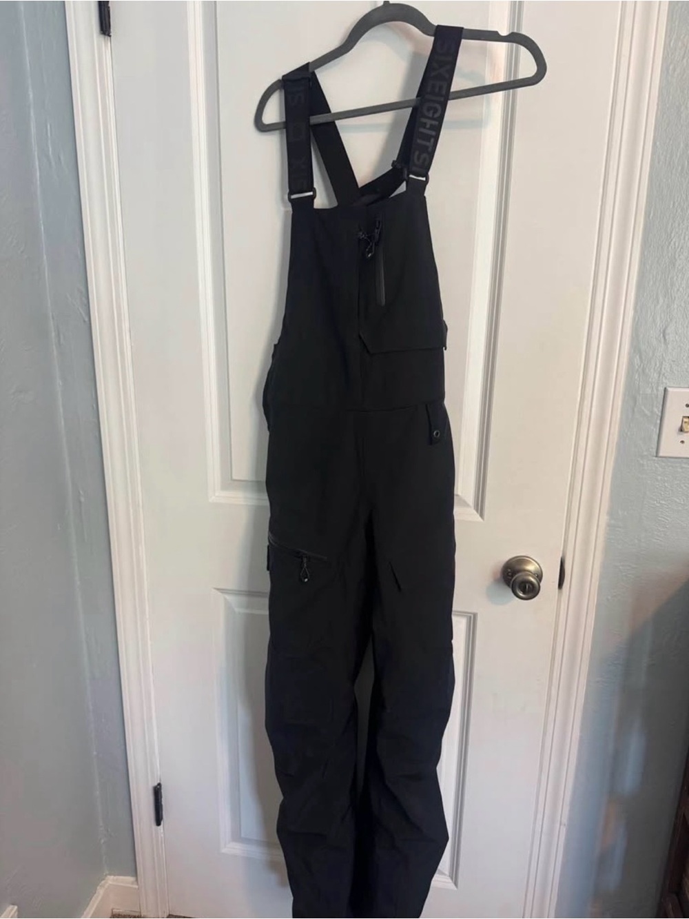 Black Utility Bib Jumpsuit with Adjustable Logo Straps